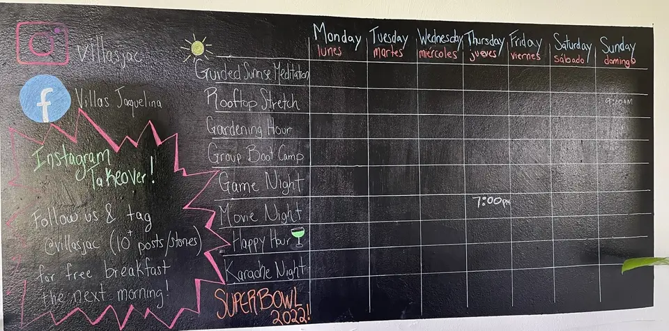 The chalkboard activity calendar from 2022: sunrise meditation, rooftop stretch, game and movie nights