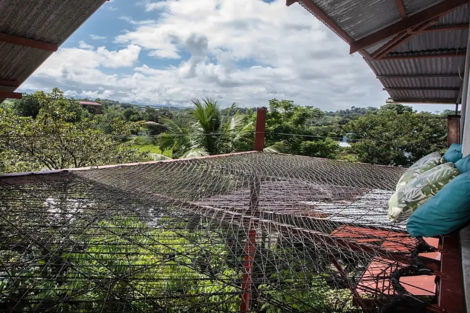 The netted hammock perch the hotel calls the bird’s nest, hanging over the treetops