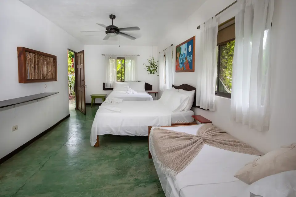 Villa Fresca: double beds, a single bed and colourful art