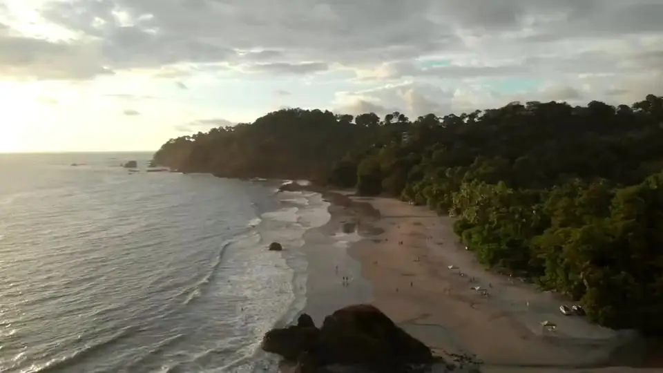 Aerial view of a Manuel Antonio beach and forested headland