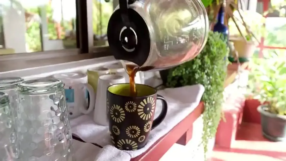 Coffee being poured on the breakfast terrace