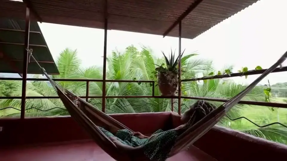 A hammock swaying on the red rooftop terrace
