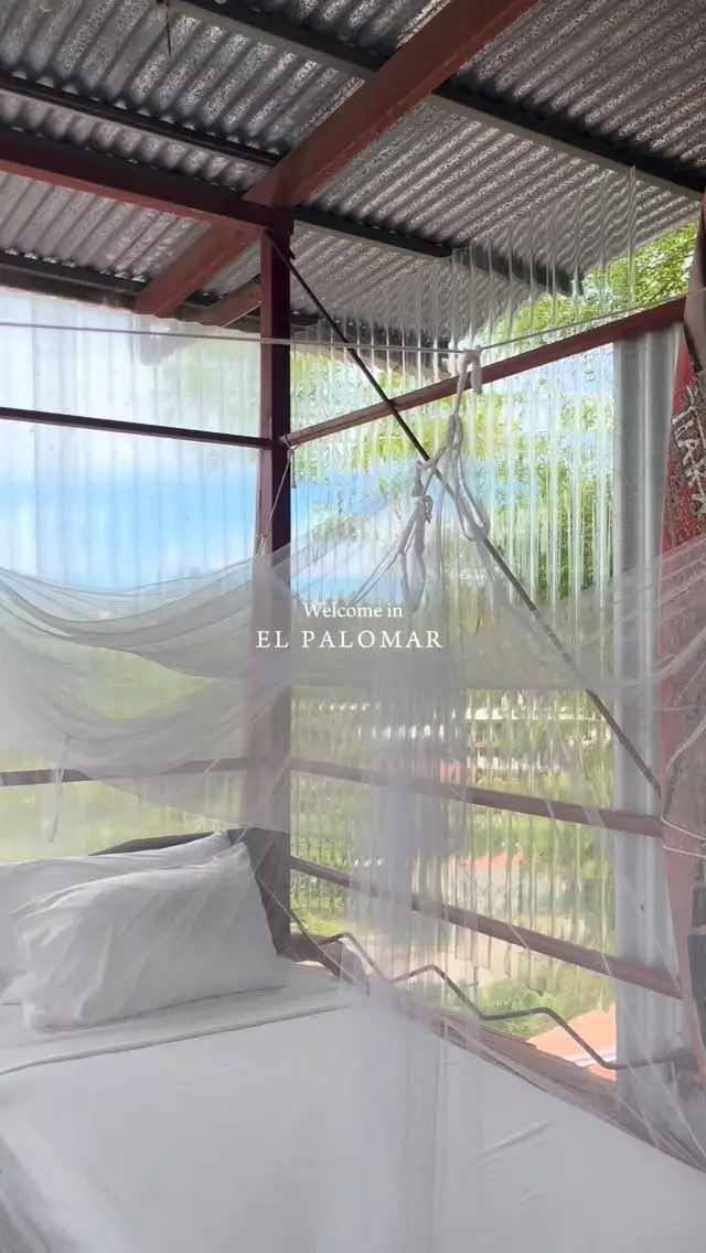 Reel cover: El Palomar, an open-air room with mosquito netting and the sky beyond