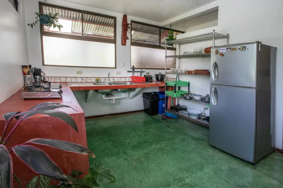 Villa Vista’s kitchen with a steel fridge and open shelves