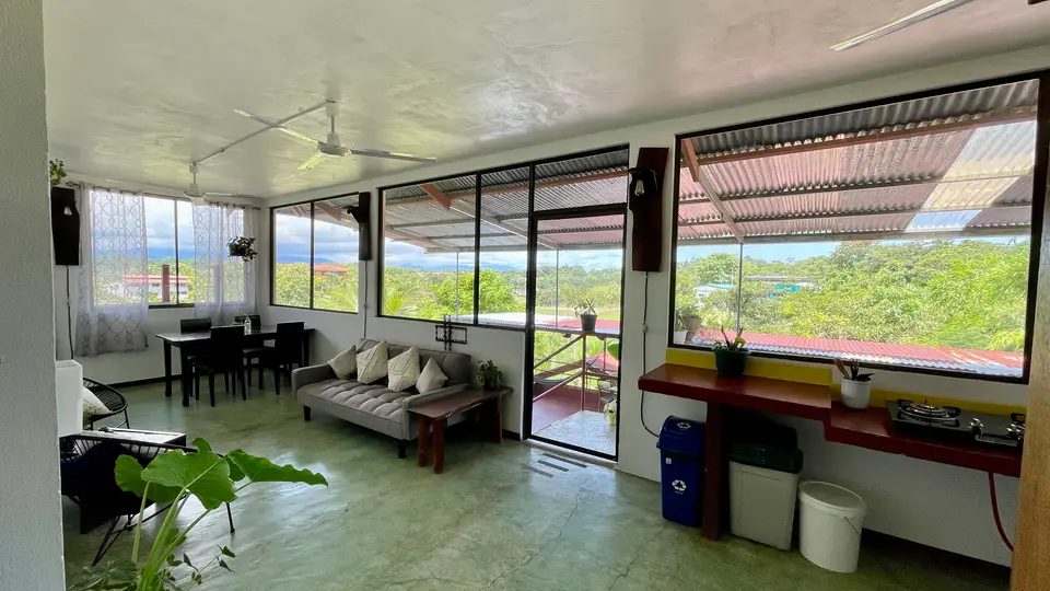 Villa Vista: the long living-dining room, with wide windows over the valley